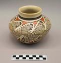 Polychrome-on-buff jar:  hatching and parrot motif