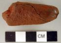 Stone object, with possible red ochre on surface