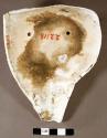 Shell ornament, incised with mask design