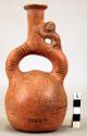 Pottery jar mouth in center of cross handle, monkey head, red