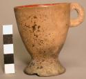 Pottery cup with handle