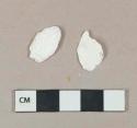 White undecorated shell fragments, heavily degraded