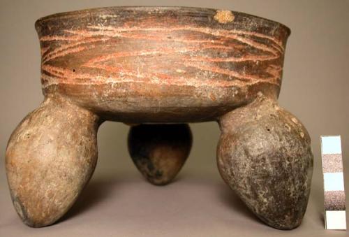 Pottery tripod bowl, with hollow supports and cylindrical body