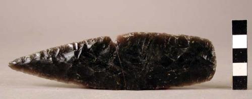 Chipped stone biface, obsidian, mended