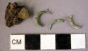 Fragments of 2 (bronze?) s-earrings and wood fragments