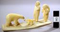 Ivory carving - man and woman in act of spearing bear