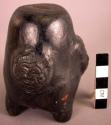 Ceramic jar, 4 moulded feet & human head at base, tapered sides