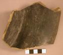 Polished black incised fragment of a flat-bottomed sloping-sided pottery bowl