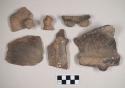Coarse earthenware body and rim sherds, effigy lugs, incised, cord impressed, shell temper