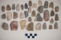 Chipped stone, flakes, blades, unifaces, biface, scrapers, perforators, triangular projectile points, ovate projectile point