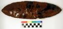 Chipped implement; chipped from red and black mottled obsidian