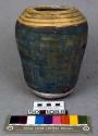 Canopic jar surmounted with lid in form of jackel-headed Duametuf