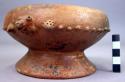 Wide mouthed shouldered unpainted pottery bowl - hollow base, birds in relief at