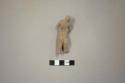 Ceramic figurine, moulded anthropomorphic, brown slip, 1 foot missing