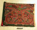 Pair of matching molas joined at one side.  Primarily grey and red, each depicts
