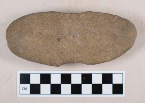 Ground stone, atlatl weight, partially perforated on both sides