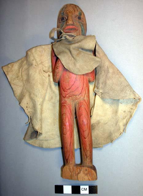 Doll representing shaman with cape