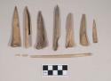 Worked animal bone awls and awl fragments, one with incised decoration; three fragments crossmend