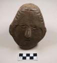 Plaster cast of head, likely originally a ground stone figurine fragment, incised and shaped