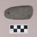 Ground stone, flat stone, one end rounded, one end sharpened, perforated at one end, one partial perforation, possible adze