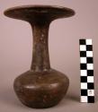 Large stick-polished pottery bottle, dark coffee-colored clay