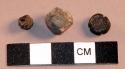 Miscellaneous objects, 1 rock, 1 seed, 1 copper bell clapper.