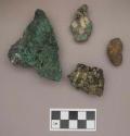 Metal, copper alloy and iron nuggets, some possibly copper and iron stained objects, one with charcoal adhered to it