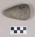 Ground stone, pecked and ground stone object, conical, tapered at one end