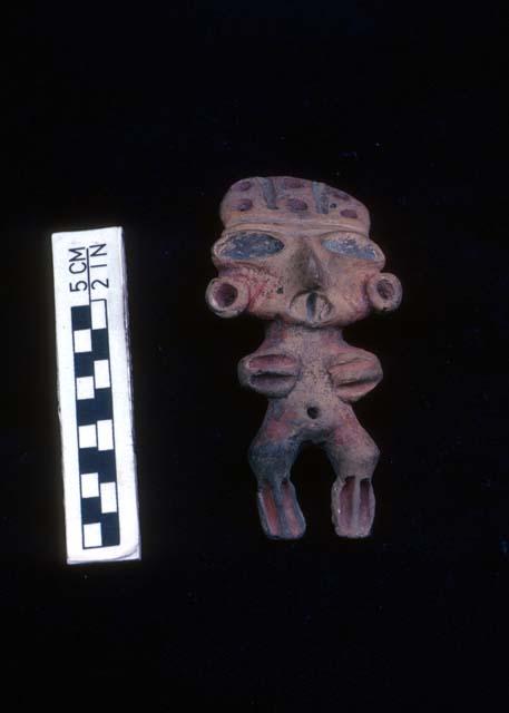 Clay figurine, type "K", light coffee-colored clay with remains of red paint