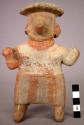 Ceramic figurine, moulded and incised standing anthropomorphic figure
