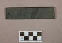 Ground stone, ornament, flat, rectangular, one end perforated, incised