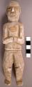 CAST, moulded and incised human figure, chipped