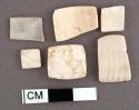 Pieces of shell (mostly cardium), rectangular. largest: 1.9 x 1.2 cm., smalles
