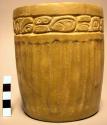 Complete ceramic vase, incised band near rim, wide incised linear design on body