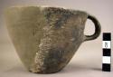 Undecorated pottery cup - one handle