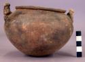 Medium-sized pottery jar with two modelled figure lugs - Armadillo ware