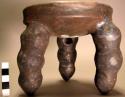 Pottery tripod bowl with three-lobed supports