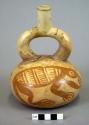 Ceramic bottle, stirrup spout, red on cream zoomorphic painted designs