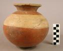 Pottery jar, red, with black ornament on base + white band