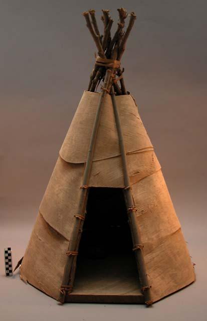Tee pee model made of birch bark and wooden sticks