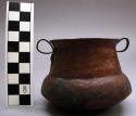 Two handled copper alloy beaker . copper is hammered.