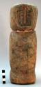 Figurine, cylindrical body w/ simply carved facial features, 2 stings beads on n