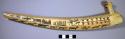 Walrus ivory pipe; etched with houses, boats, etc..