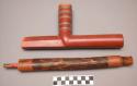 Catlinite pipe with wooden mouthpiece and stem.