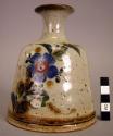 Ceramic polychrome glazed narrow-necked stoneware vase with floral design