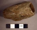 Ground stone, pipe bowl with incised decoration and chipped rim