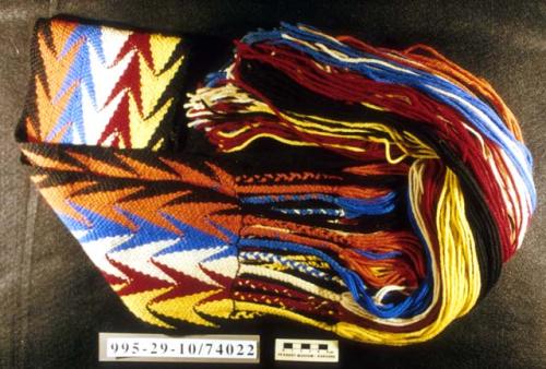 Finger woven Arrowhead pattern sash, in black, orange, blue, white, maroon, and