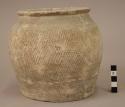 Pottery urn - grey ware; design of cross hatching