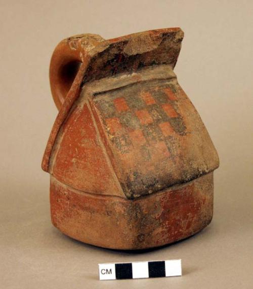 Red stirrup pot, representing a noble's dwelling or a mortuary facility