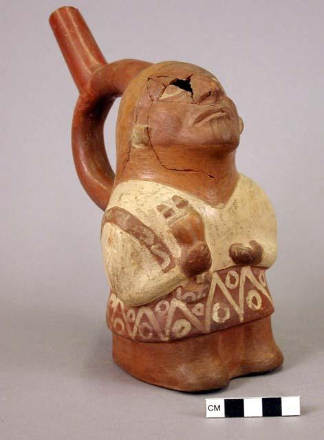 Ceramic bottle, stirrup spout, human effigy